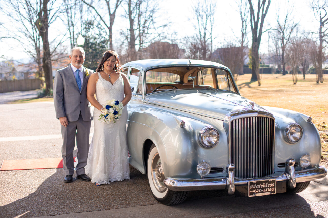 elopement couple next to silver vintage Rolls Royce limo